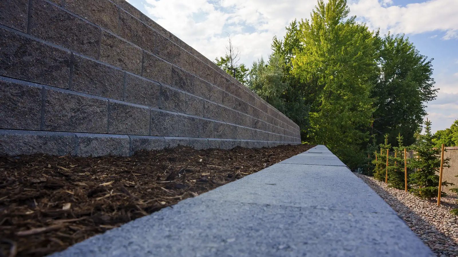Stacked stone retaining wall