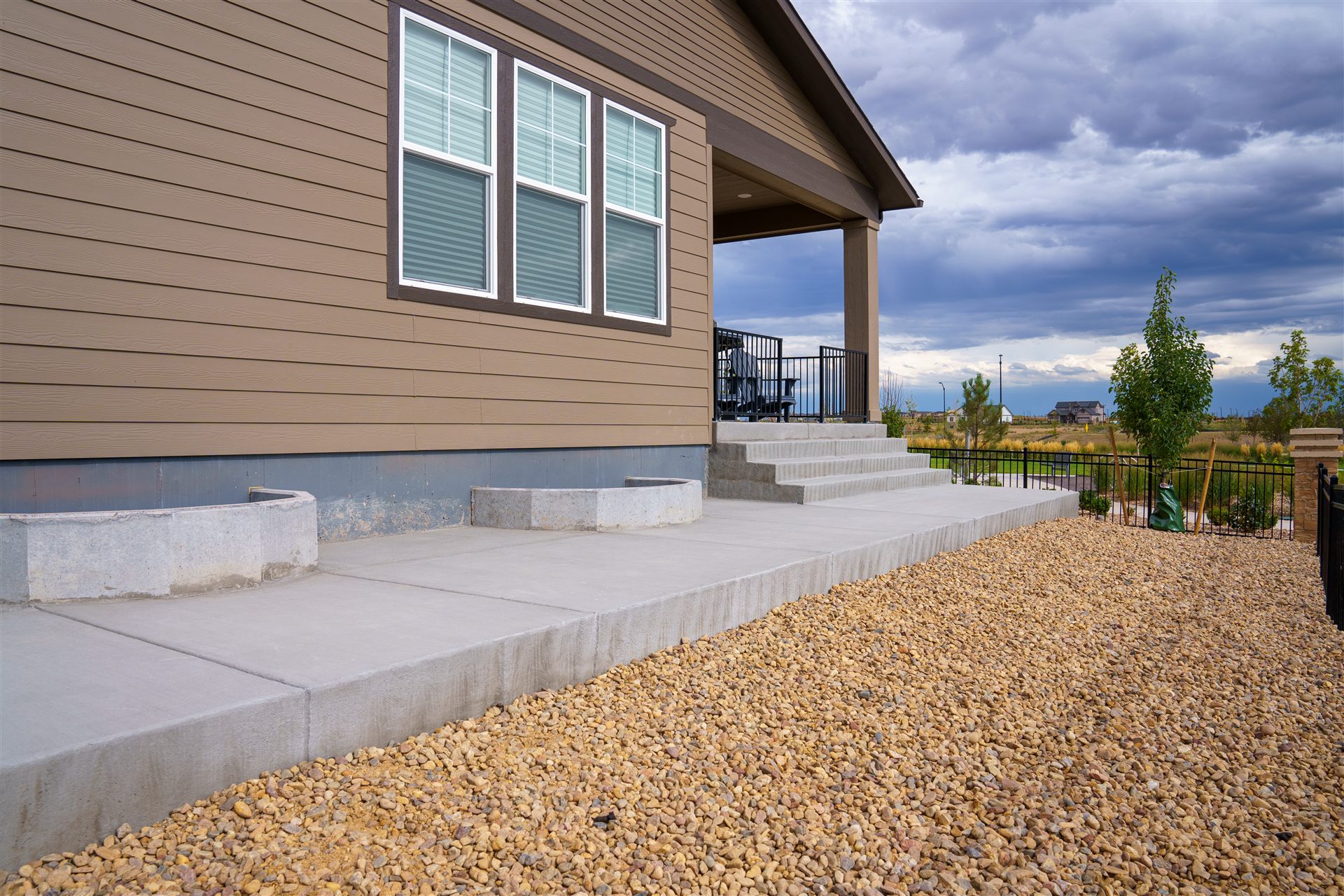 Concrete patio and steps off a covered porch