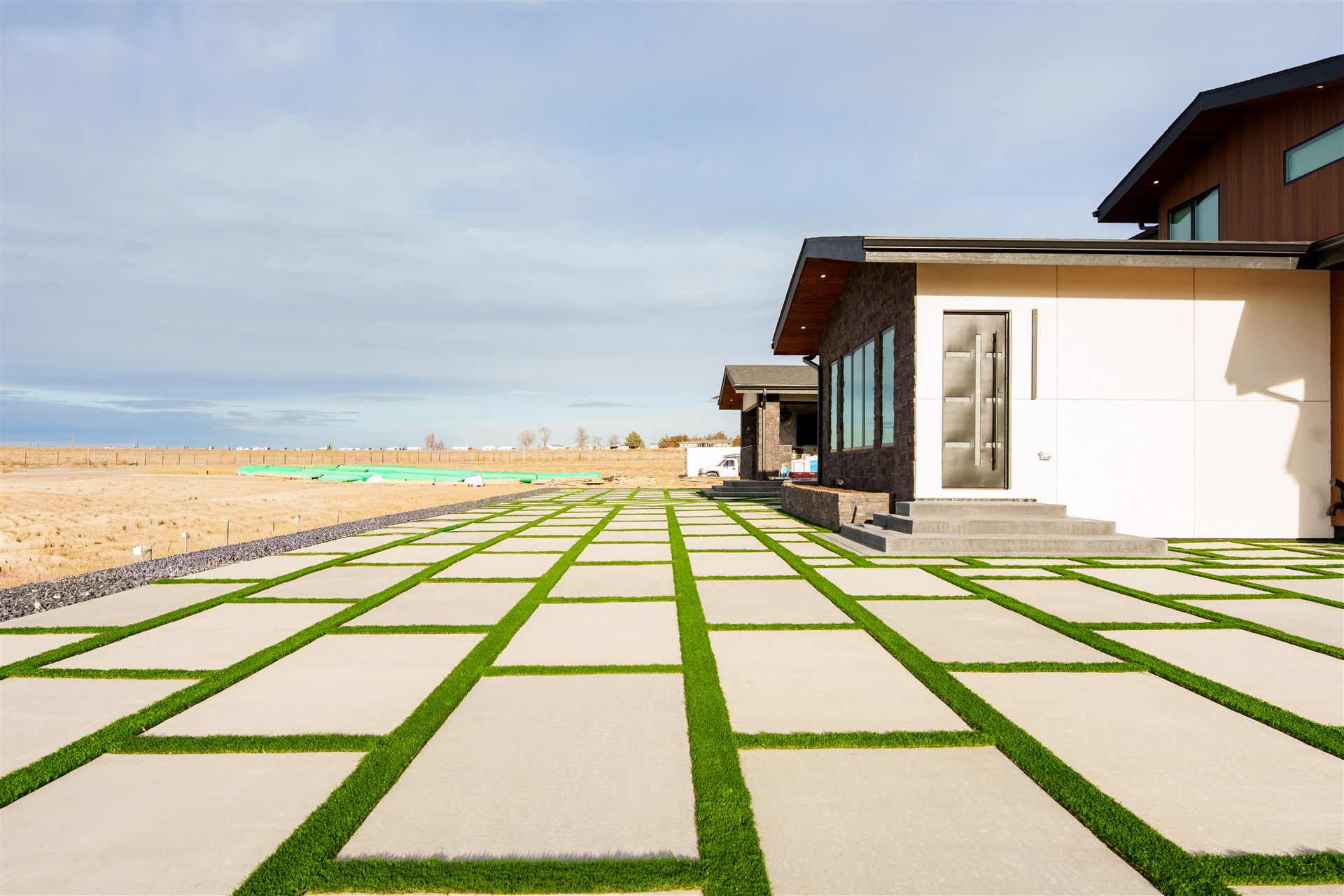 Rows of concrete slabs separated by synthetic turf strips