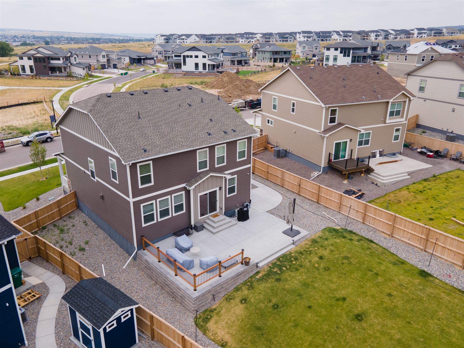 Aerial view of a raised concrete patio behind a Broomfield home
