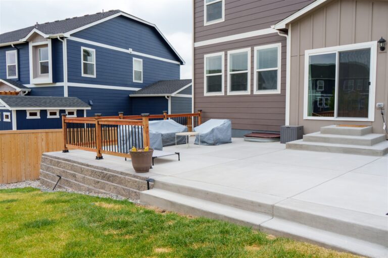 Raised concrete patio on a block retaining wall in Broomfield, CO