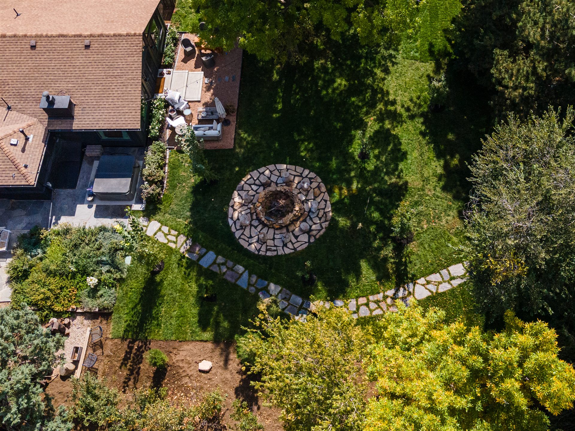 Aerial view of a backyard fire pit and flagstone path in Castle Rock, CO