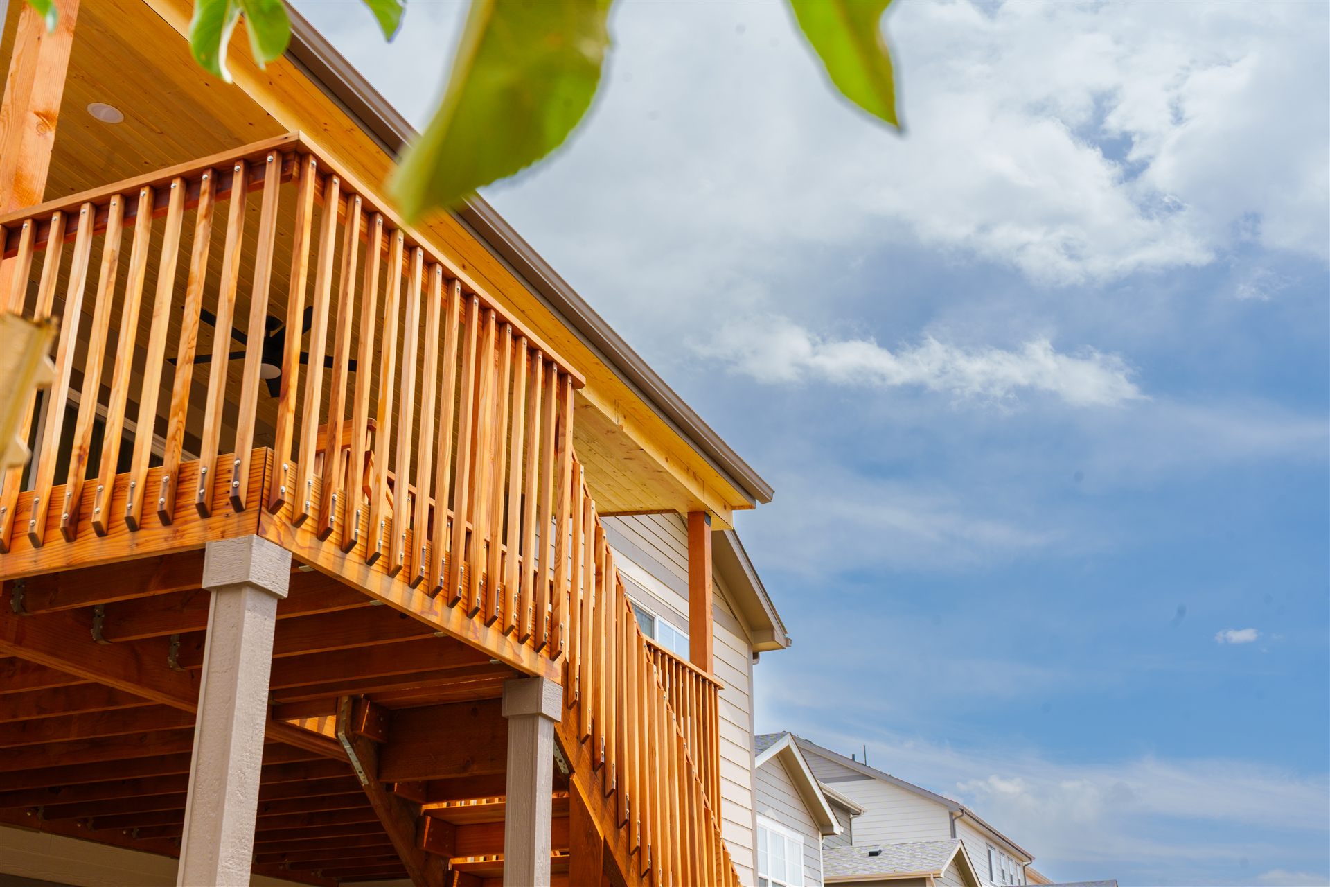 Stained wood deck railing and support posts