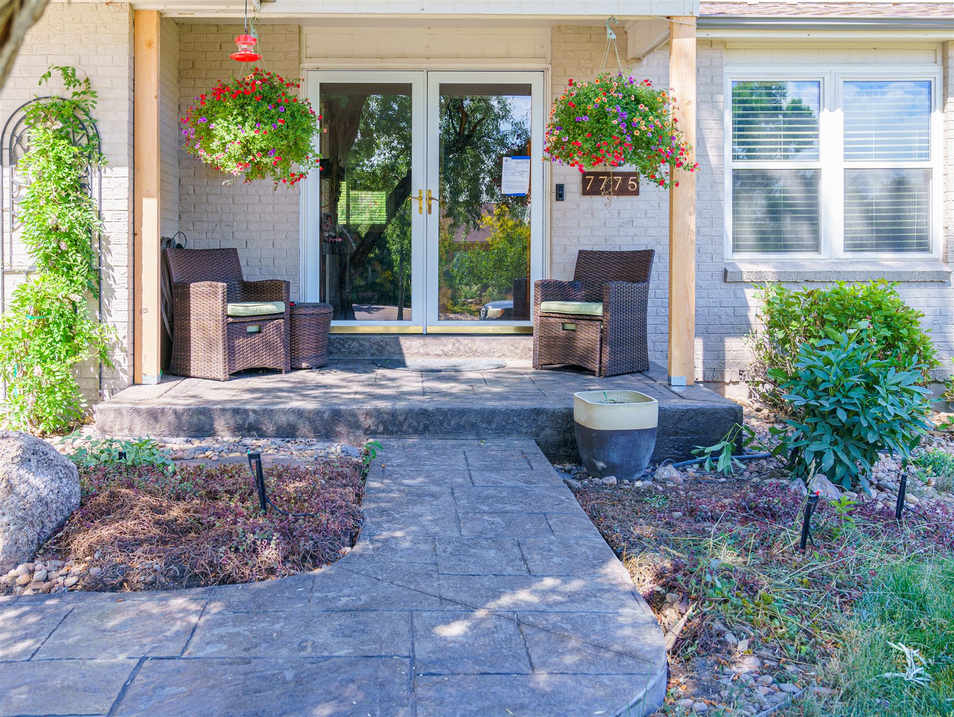 Curved stamped concrete front walkway to a porch in Castle Rock, CO