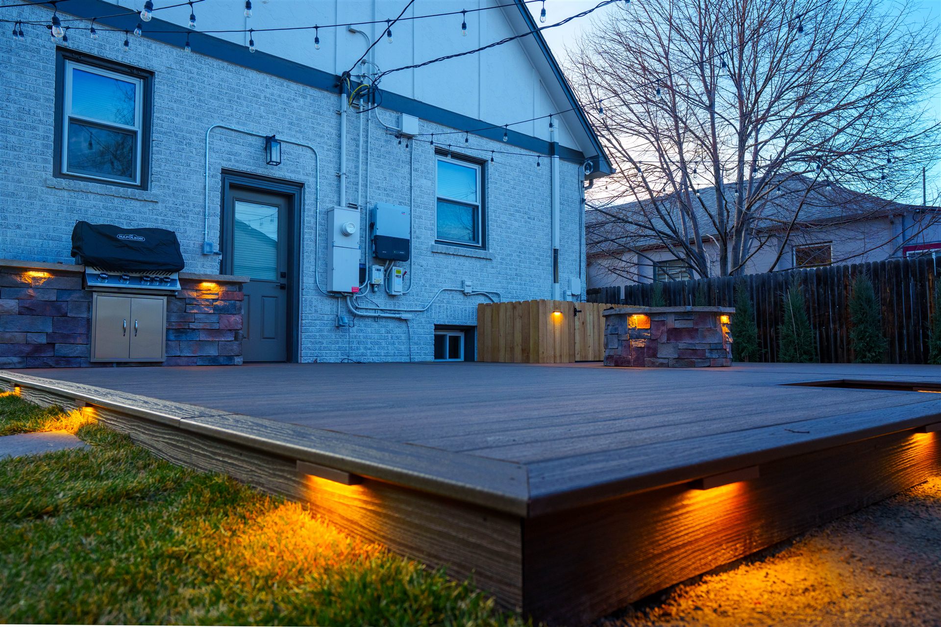 Low-voltage step lights built into the edge of a composite deck