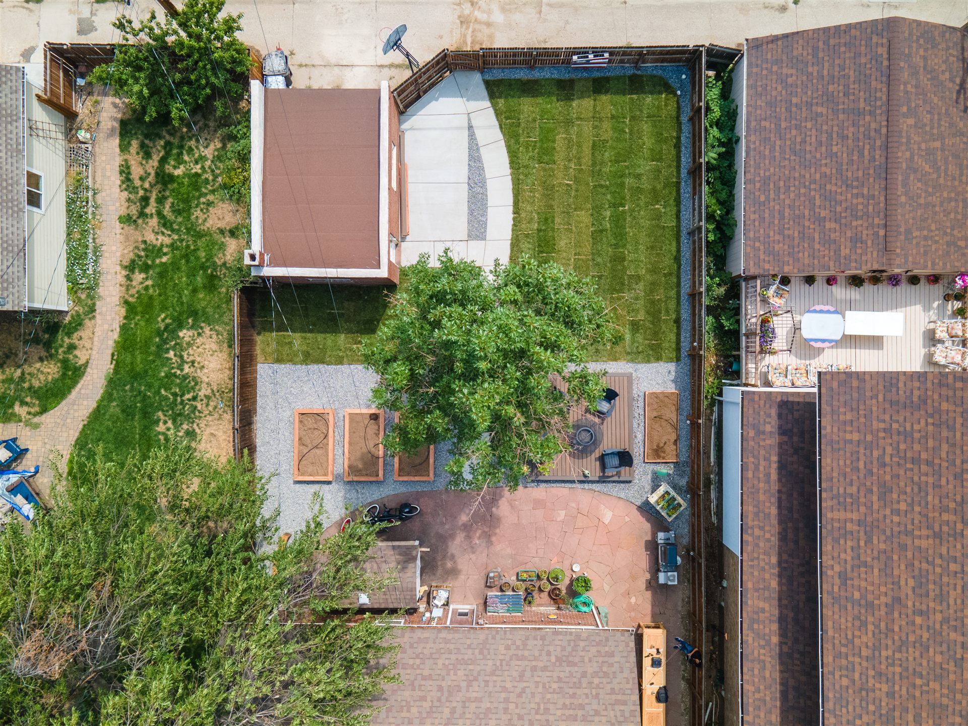 Overhead view of a new sod lawn, deck and garden area
