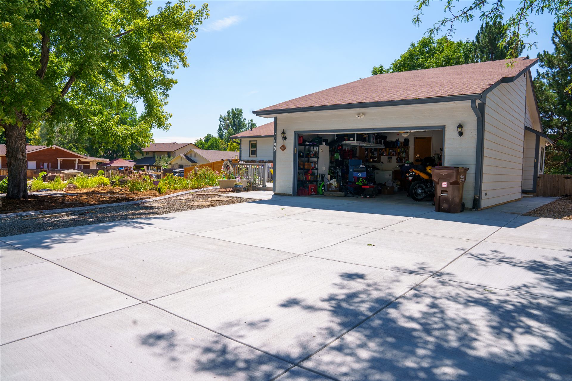 Wide concrete driveway in front of a detached garage in Commerce City