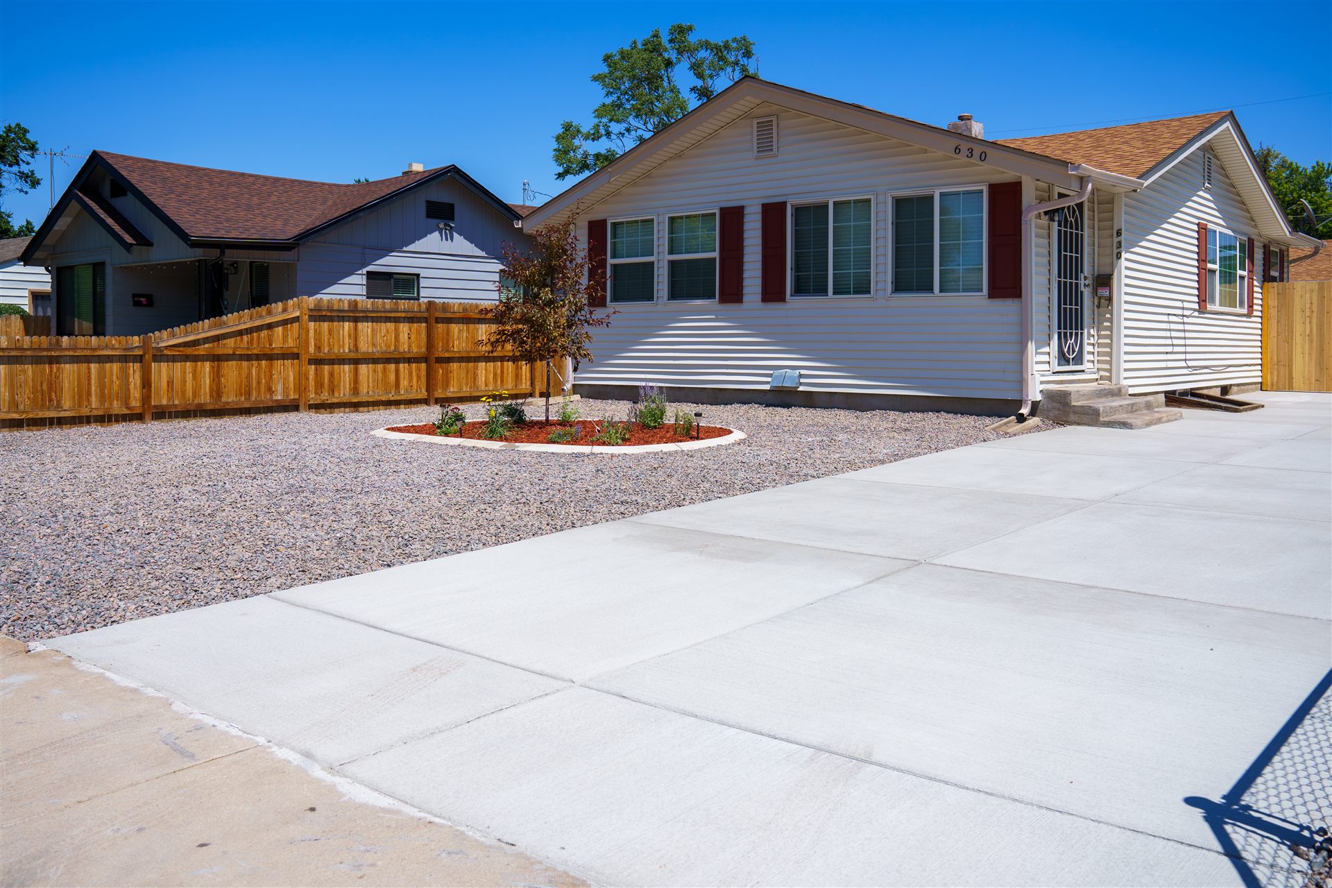 New concrete driveway beside a home in Commerce City, CO