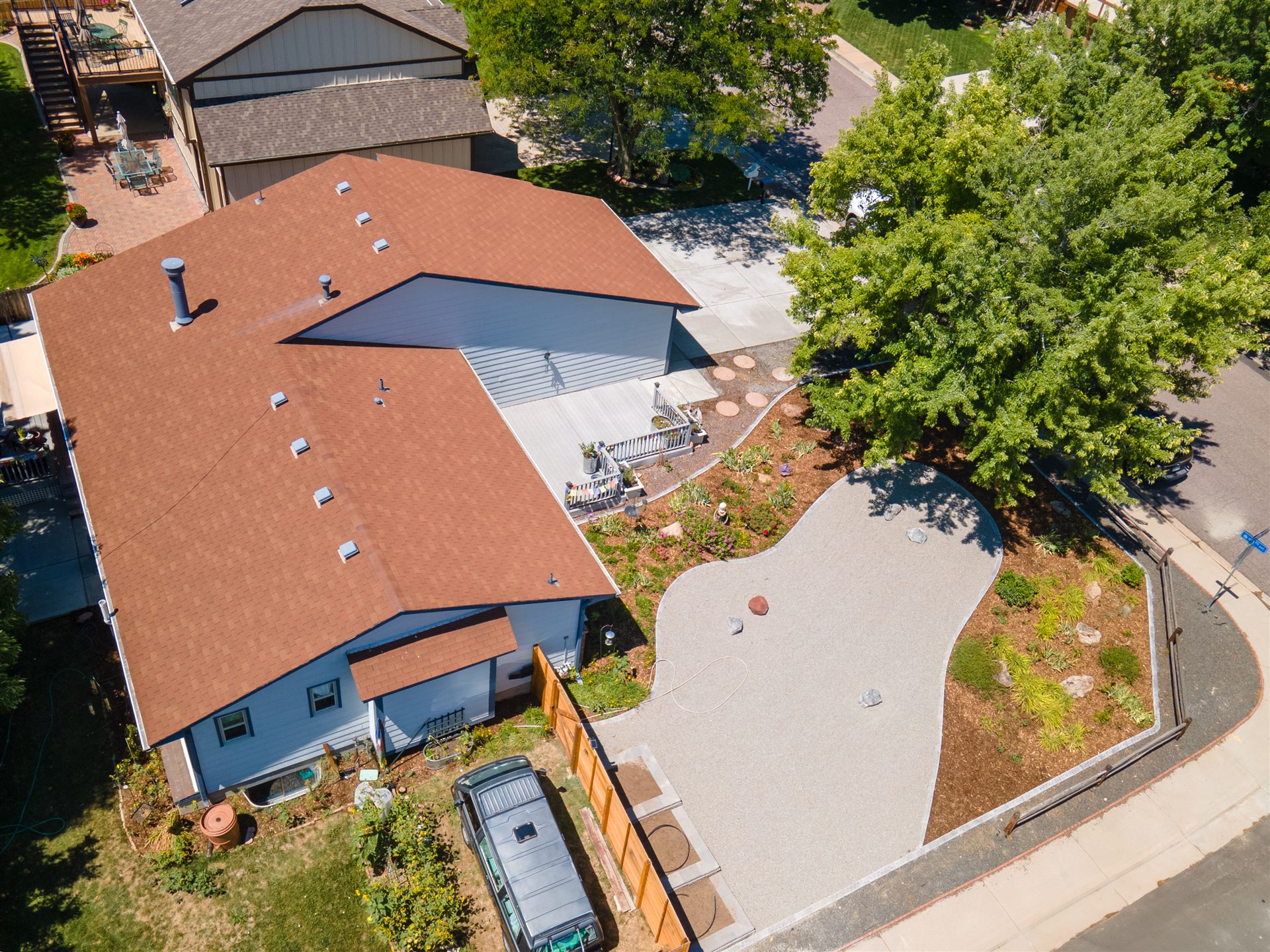 Aerial view of a concrete patio and landscaped side yard