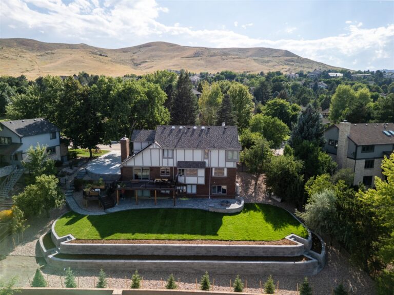 Long curved block retaining wall and new sod lawn in Lakewood, CO
