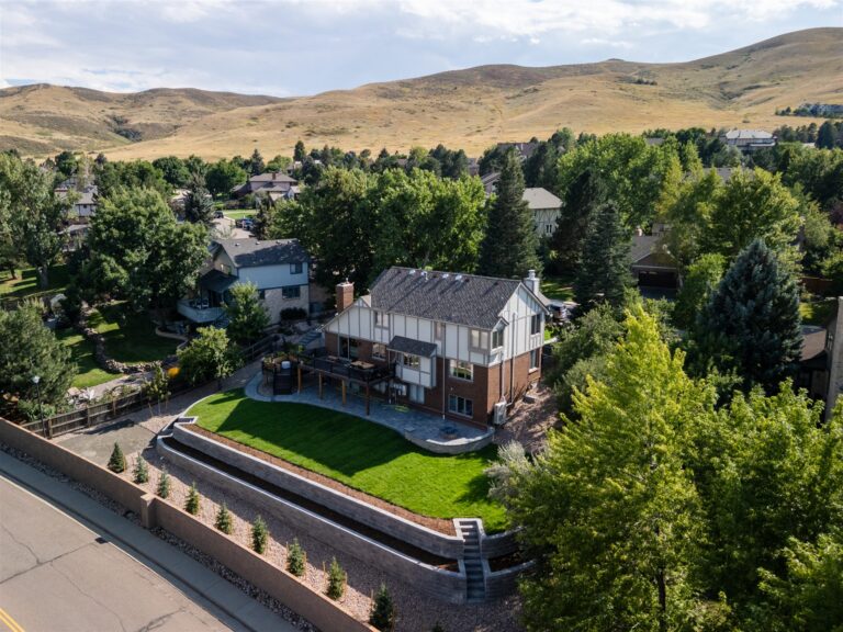 Aerial view of a curved block retaining wall and level lawn in Lakewood, CO