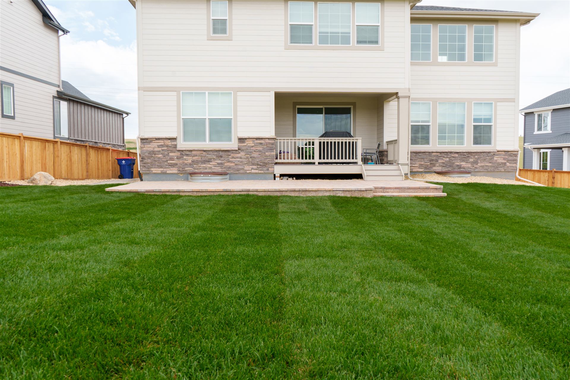 Freshly installed sod lawn behind a new home