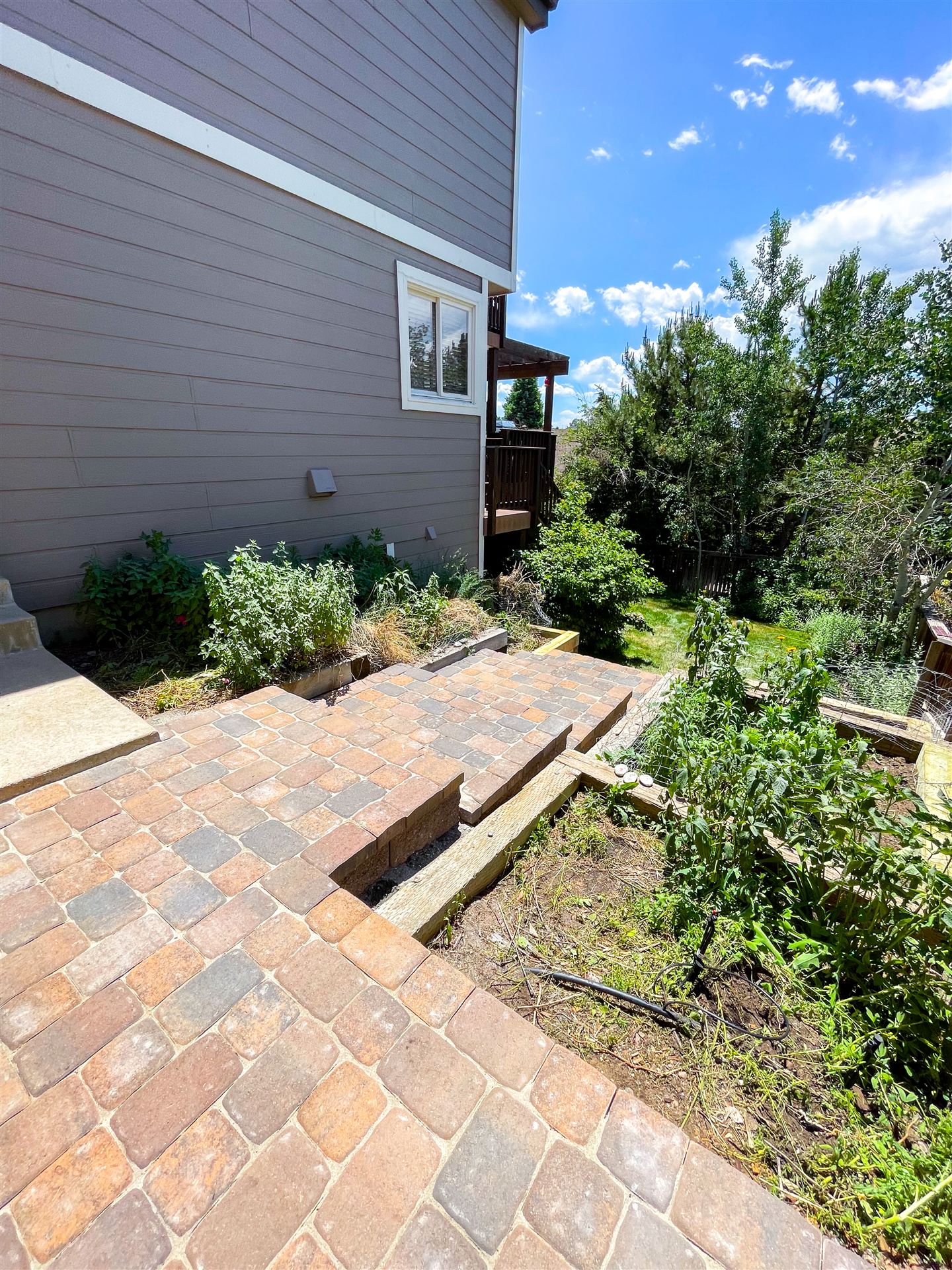 Paver walkway and steps on a sloped side yard