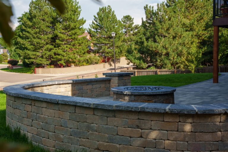 Curved stone seat wall around a fire pit in Littleton, CO