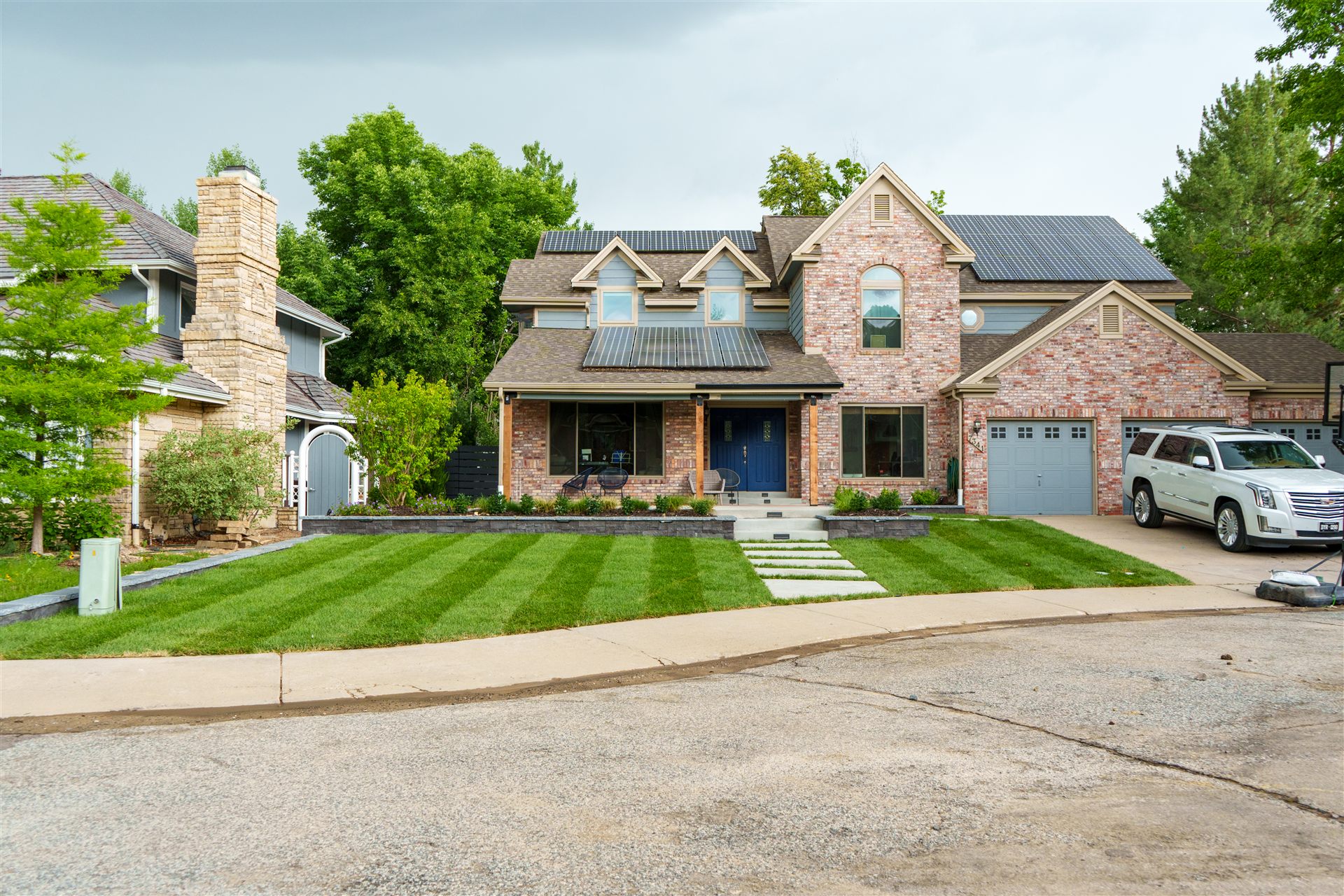 Front yard with new sod and concrete stepping pads in Lone Tree, CO