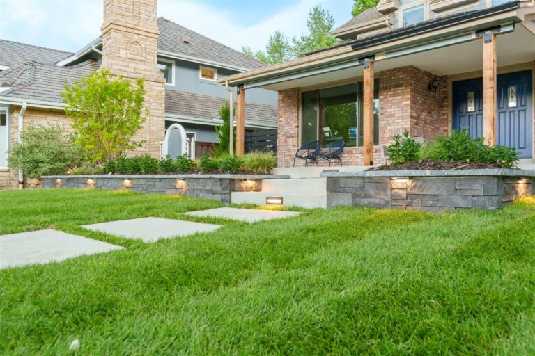 Low stone retaining wall with built-in lights in Lone Tree, CO