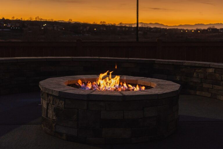 Stone veneer fire pit at sunset in Lone Tree, CO