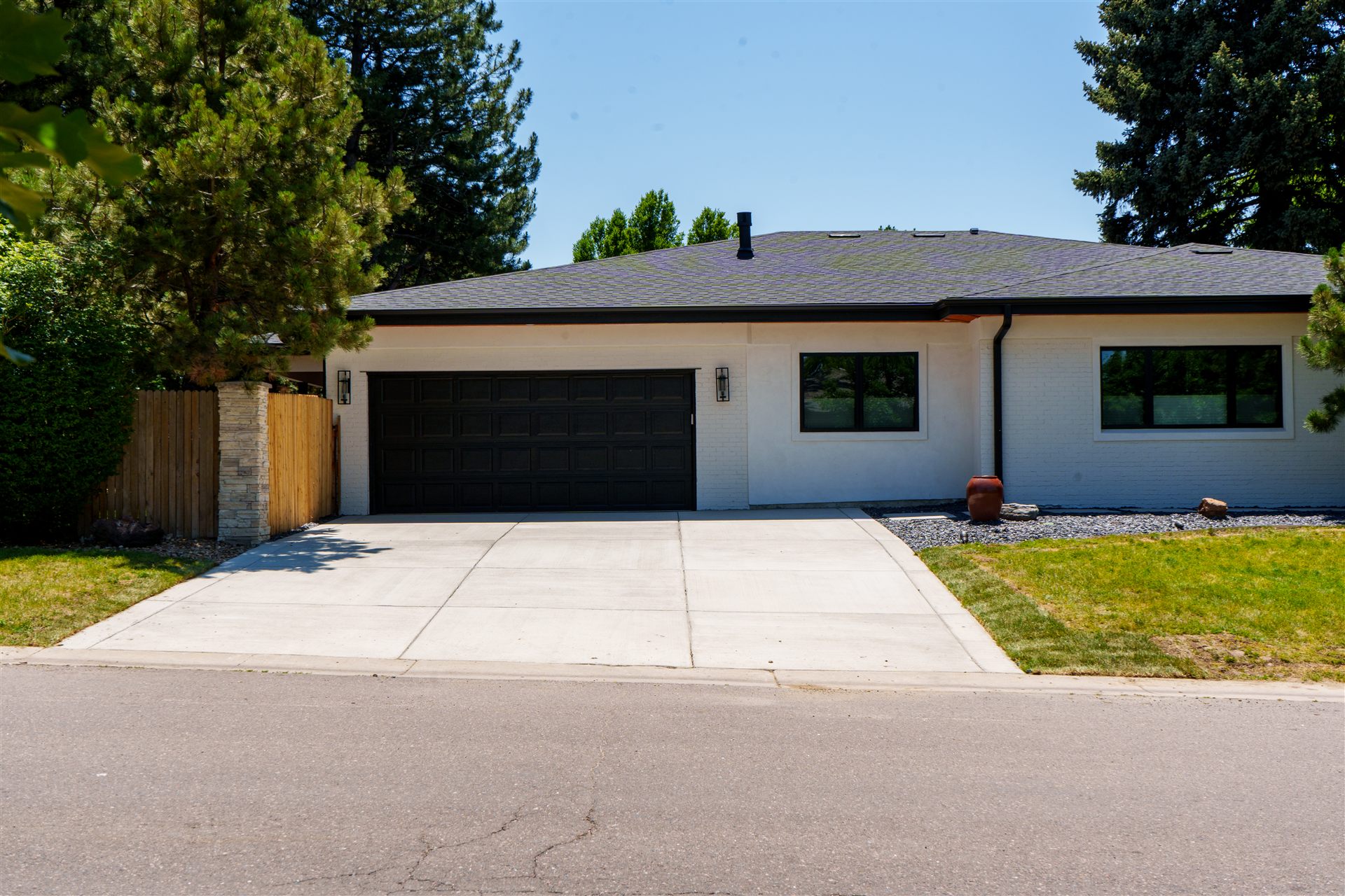 New concrete driveway in front of a modern home