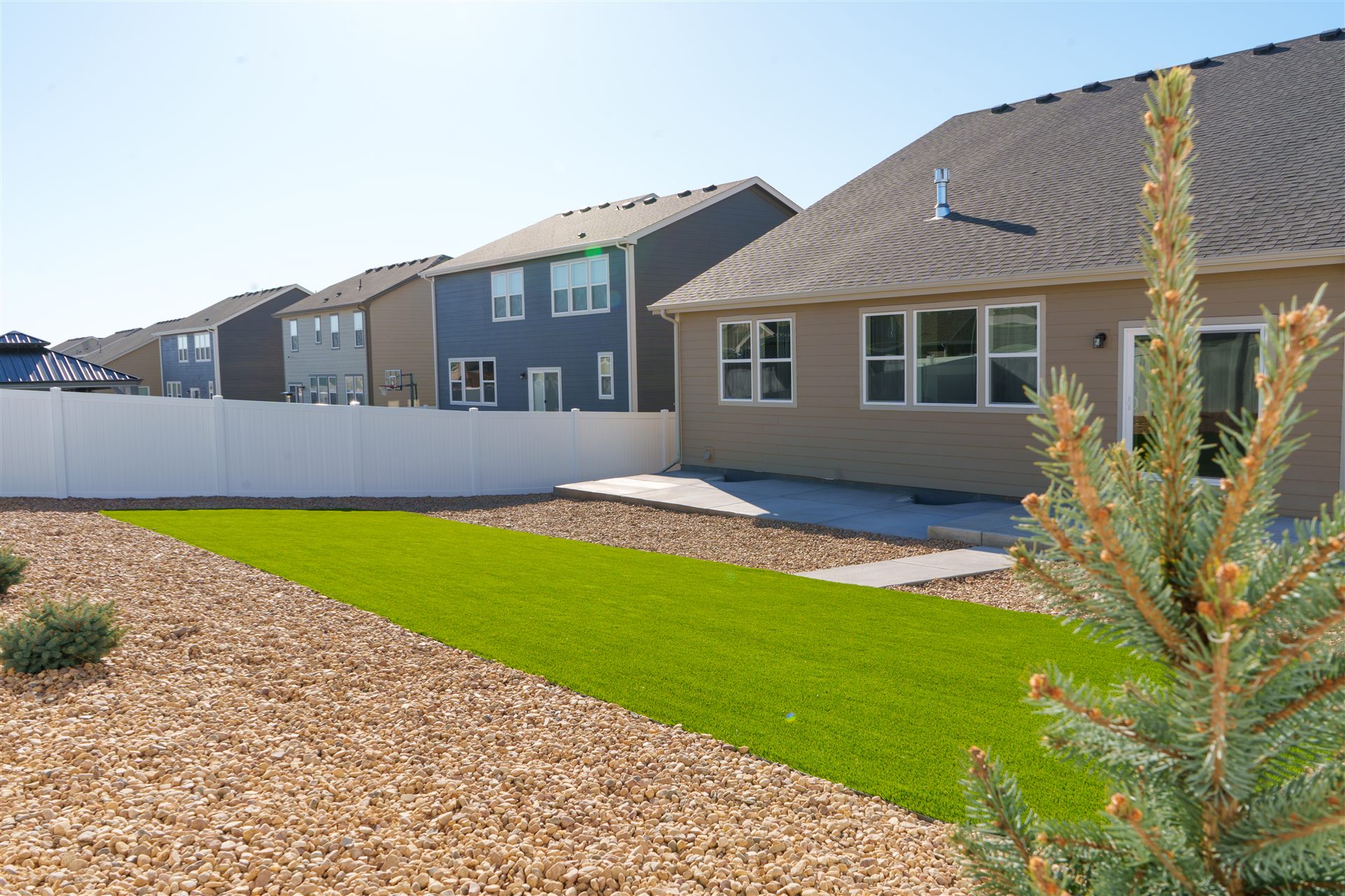 Synthetic turf and rock in a new-build backyard